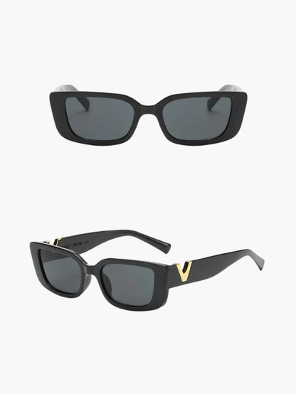 Black sunglasses with dark lenses and gold V temple detail, front and angled views.