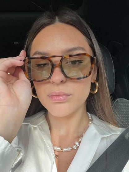 Tortoiseshell brown square sunglasses with amber-tinted lenses and slim metal hinges