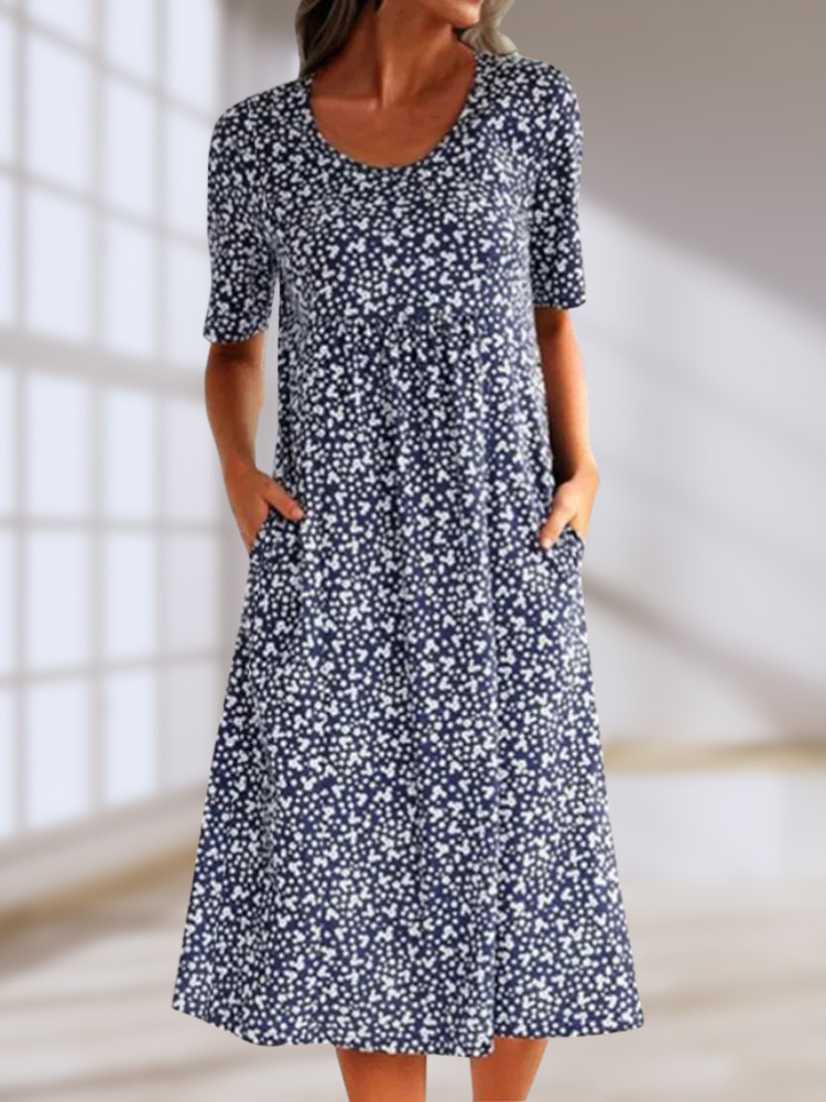 Floral summer dress in navy with short sleeves and scoop neckline, midi length