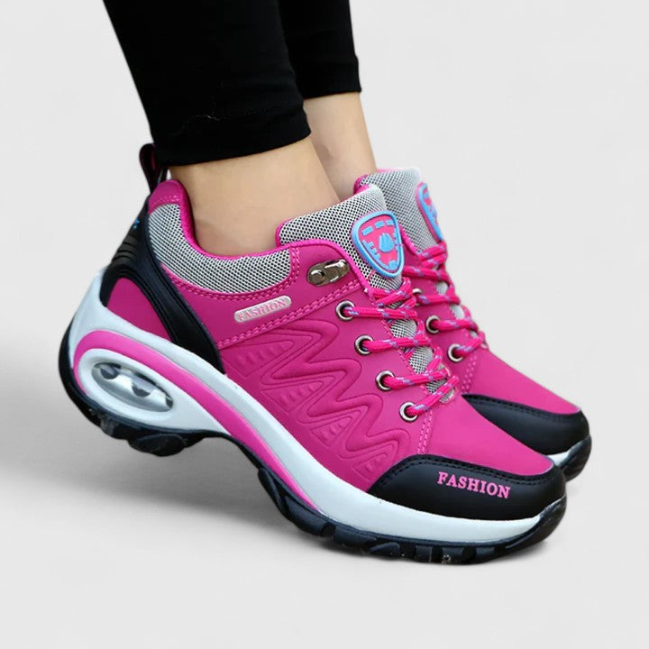 Novira women’s sport shoes, pink upper with gray collar and pink laces, side view