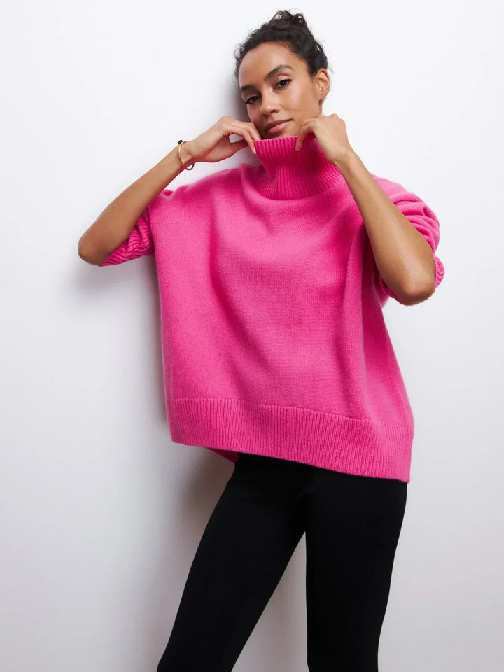 Pink turtleneck sweater with ribbed cuffs and hem
