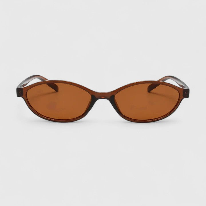 Sunglasses with brown tortoiseshell frames and amber lenses, rounded cat-eye design
