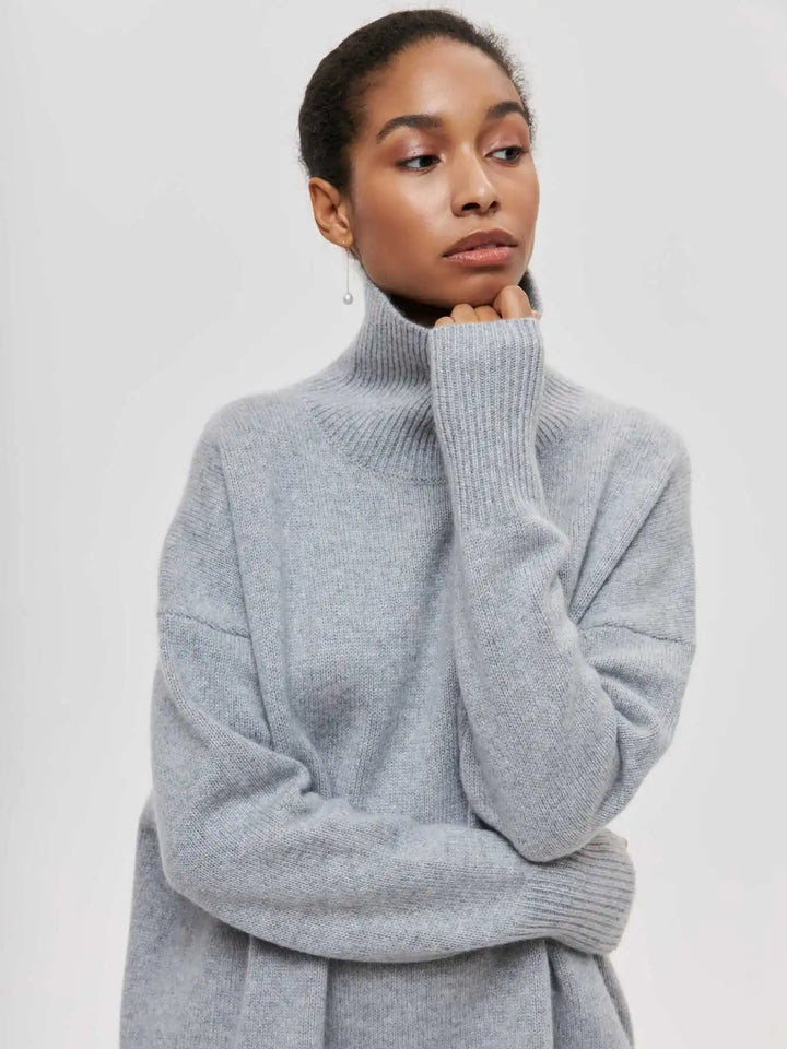 Gray turtleneck sweater with ribbed collar and cuffs, long sleeves, relaxed fit