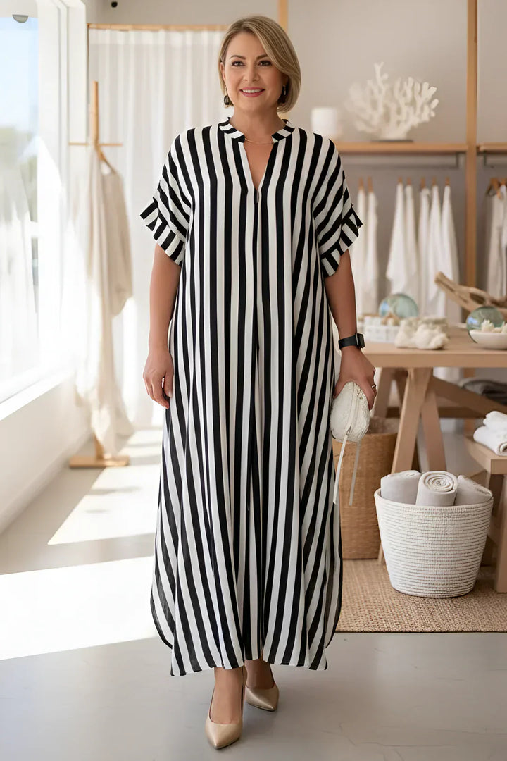 Black-and-white striped maxi dress with V-neck and short flutter sleeves, long length