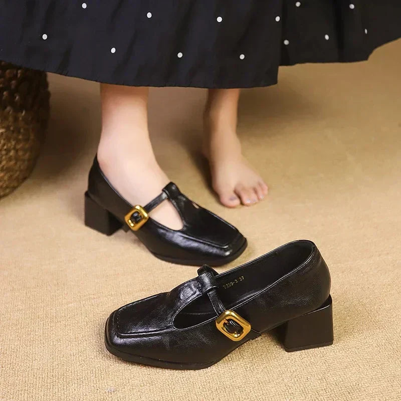 Black Mary Jane pumps with T-strap and gold buckle square toe block heel