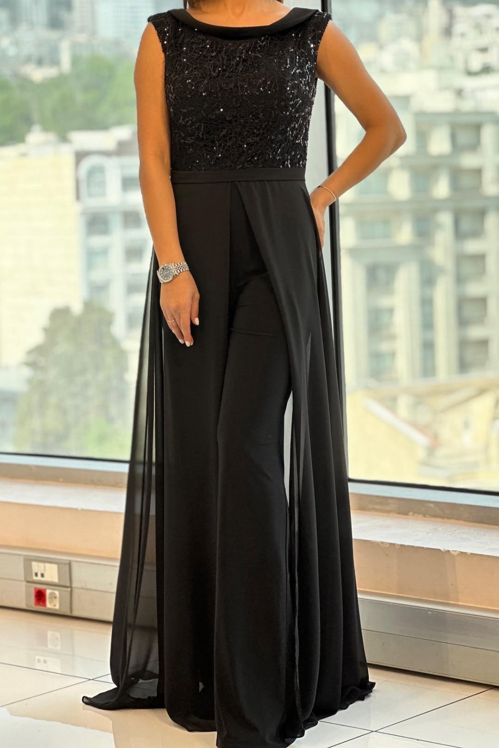 Black sleeveless textured tulle jumpsuit with wide-leg flowing pants
