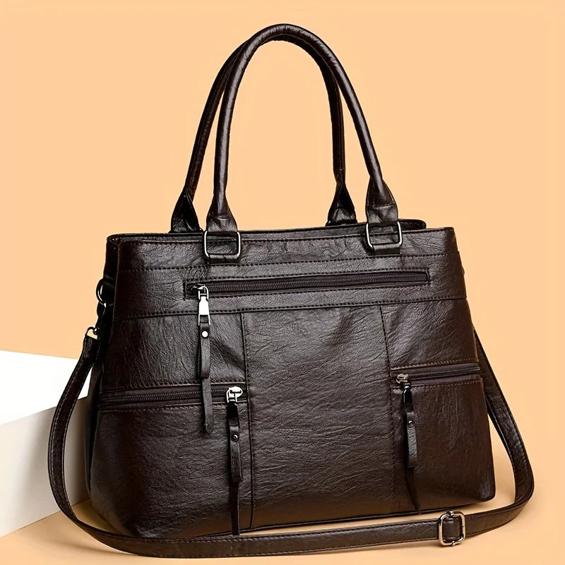 Espresso brown leather women’s tote bag with double handles, front zip pocket and crossbody strap