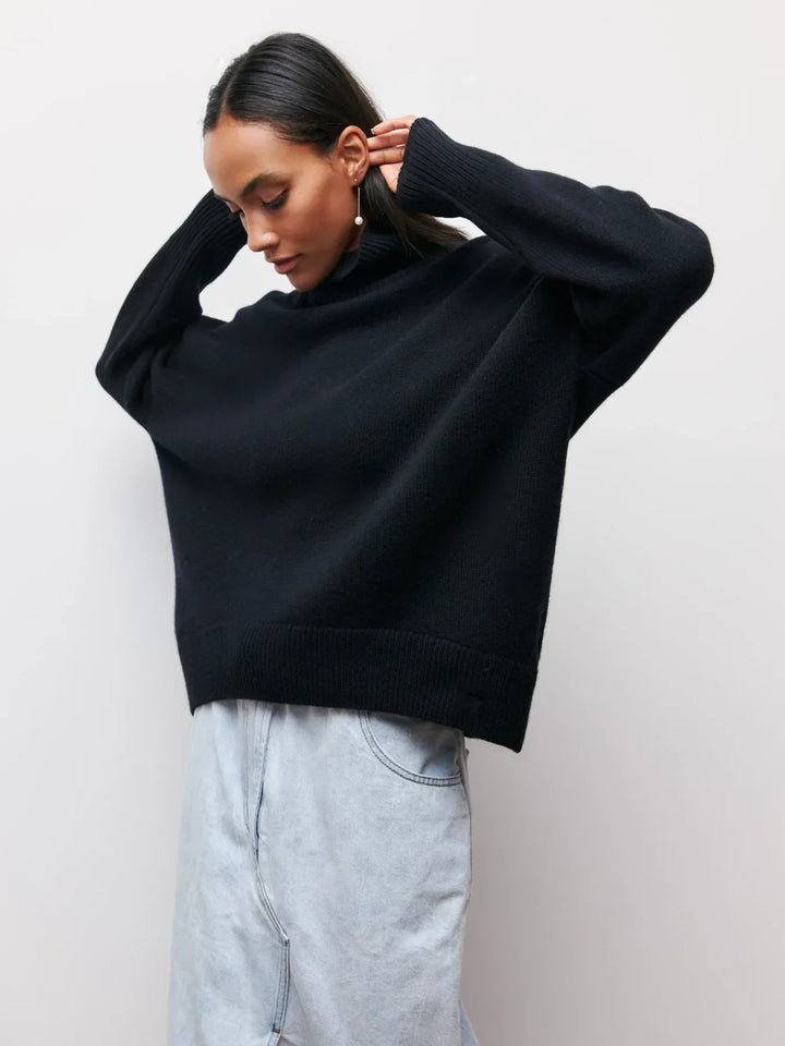 Black turtleneck sweater with ribbed hem and long sleeves