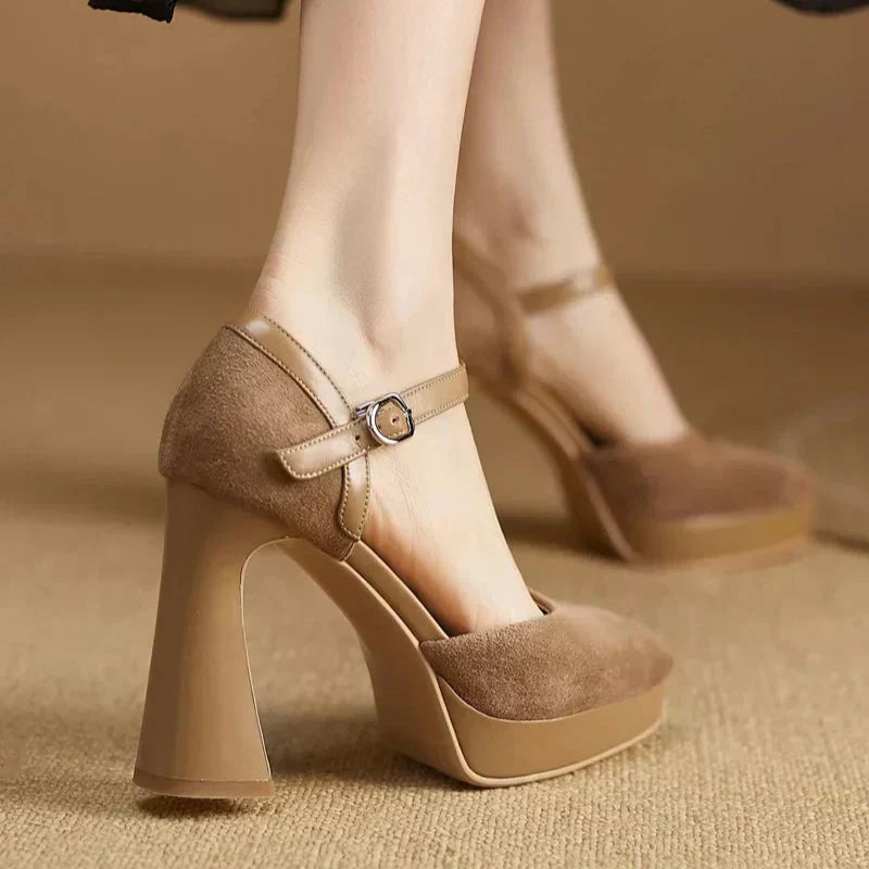 Brown suede pumps with ankle strap buckle and chunky block heel, side view