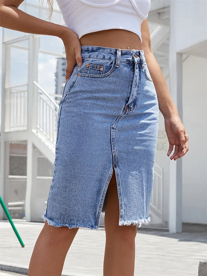 Denim midi skirt in medium blue wash with front slit and frayed hem
