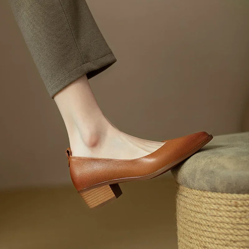 Brown leather slingback pumps with low block heel and almond toe