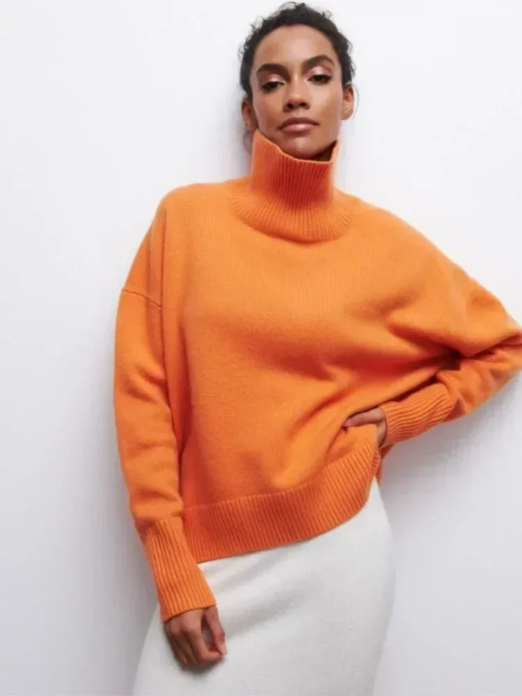 Orange turtleneck sweater with long sleeves and ribbed collar and cuffs