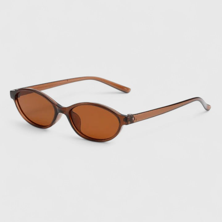 Sunglasses with brown tortoiseshell frames and amber lenses, front-side angle