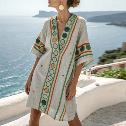 Women’s beach dress, cream linen-look with green circle print and orange trim, V-neck