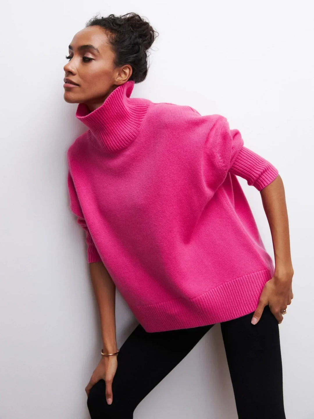 Hot pink turtleneck sweater with short sleeves and ribbed collar and cuffs