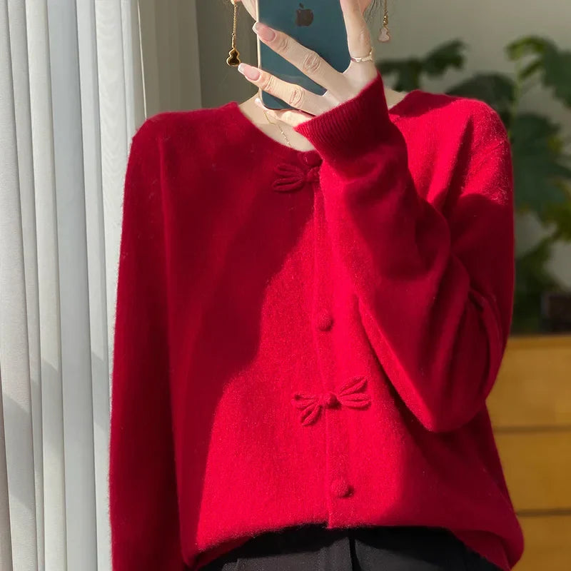Red bow-front cardigan with button placket and bow detail at center