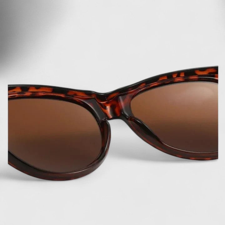 Sunglasses with tortoise-pattern frame and brown lenses, side profile