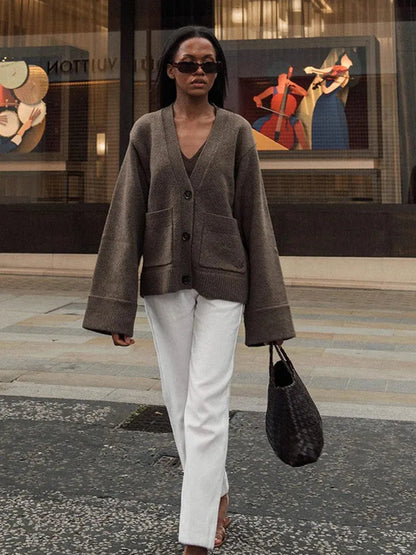 Brown V-neck knit cardigan with V-neckline and patch pockets
