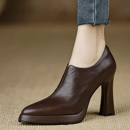 Brown leather-look heeled pumps with rounded toe and side zipper detail