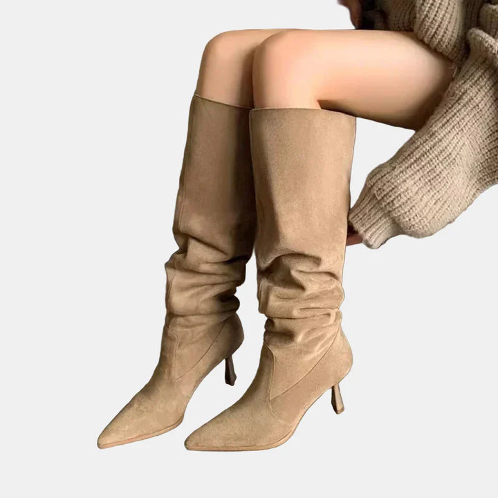 Khaki pointed-toe heeled cowboy boots, tall slouchy shaft, curved heel