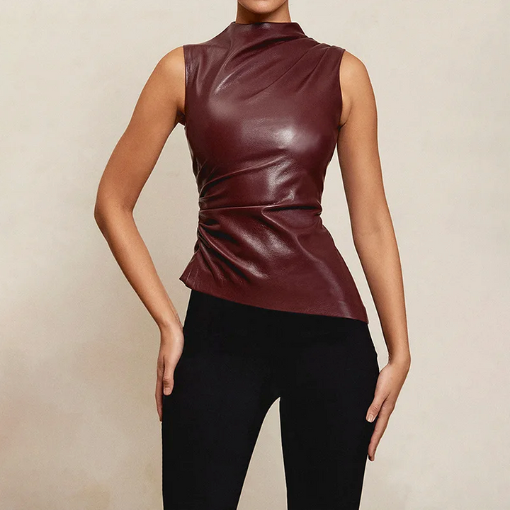 Women’s sleek faux leather top in burgundy, sleeveless high neck and peplum-style hem