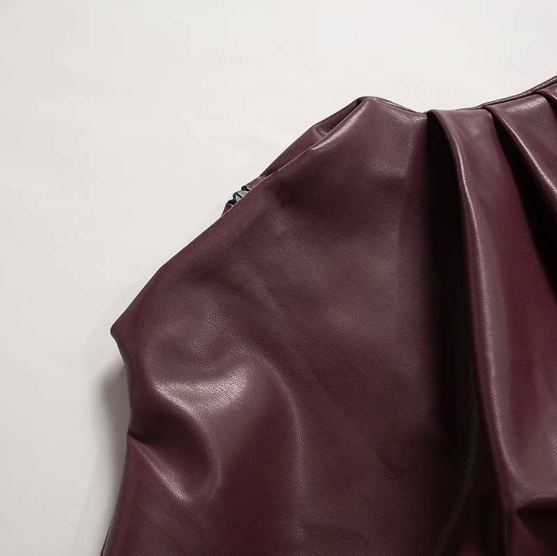 Women’s sleek faux leather top fabric detail in burgundy, ruched at the shoulder seam