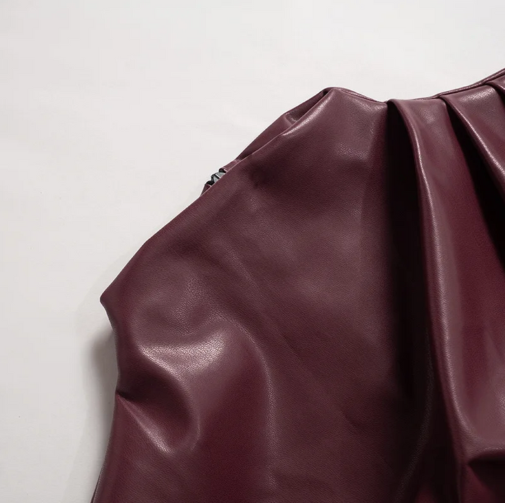 Women’s sleek faux leather top fabric detail in burgundy, ruched at the shoulder seam