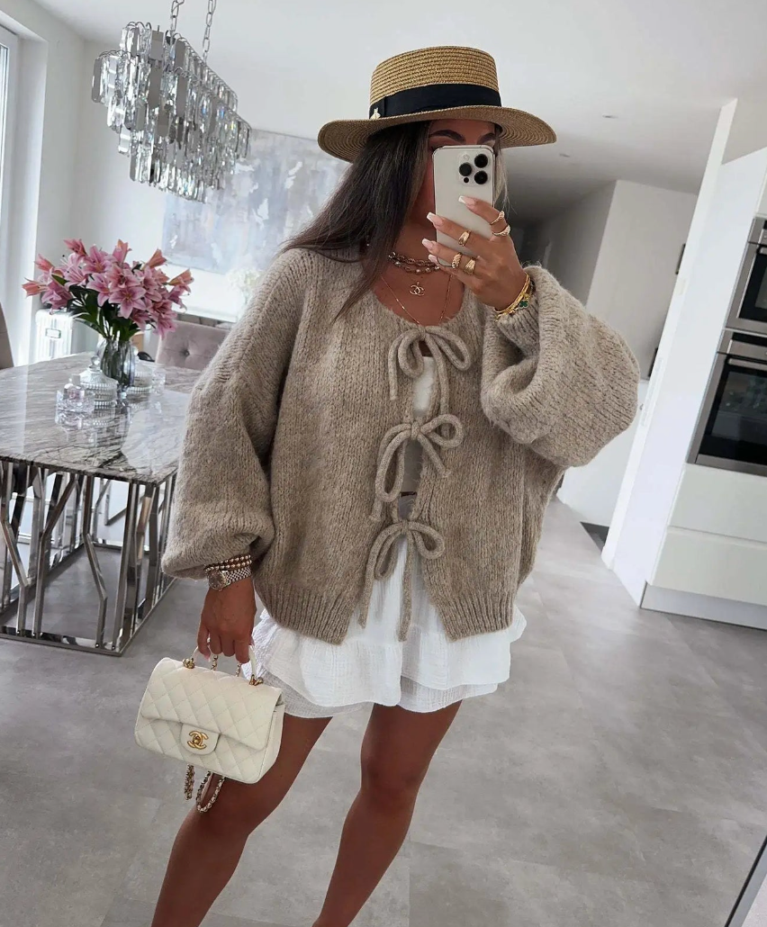 Khaki knitted bow cardigan with front bow ties and drop-shoulder sleeves.