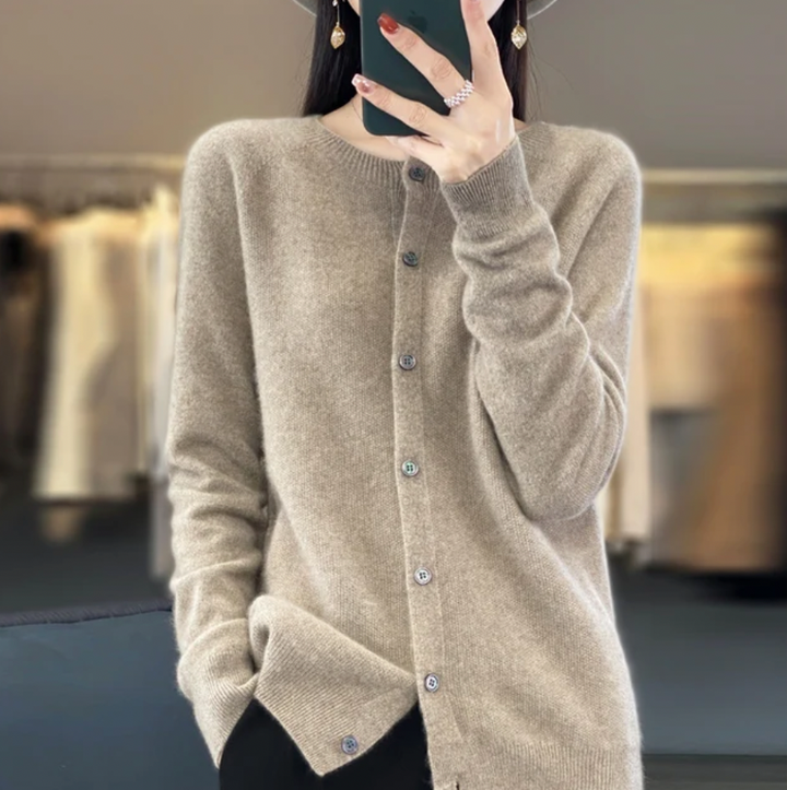 Beige soft button-up cardigan sweater with front buttons, ribbed hem, and long sleeves