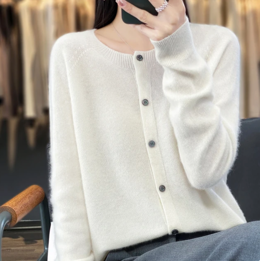 White soft button-up cardigan sweater with front button placket and ribbed cuffs