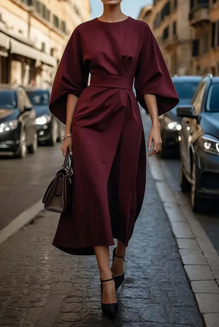 Burgundy lantern-sleeve midi dress with tied waist and side drape