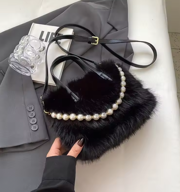 Black faux fur crossbody bag with pearl-bead trim and adjustable shoulder strap