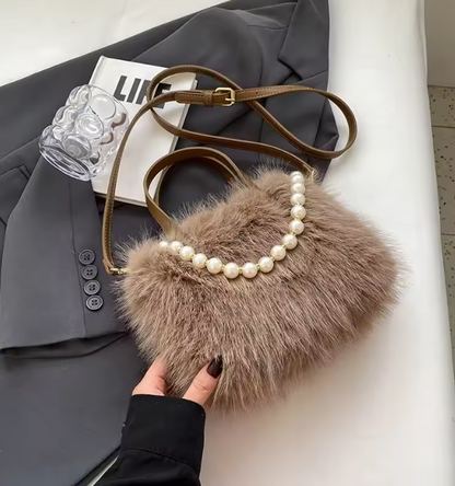 Brown faux fur crossbody bag with pearl-bead trim and adjustable shoulder strap