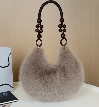 Maine faux hobo handbag with gray faux-fur body and beaded handles with rings