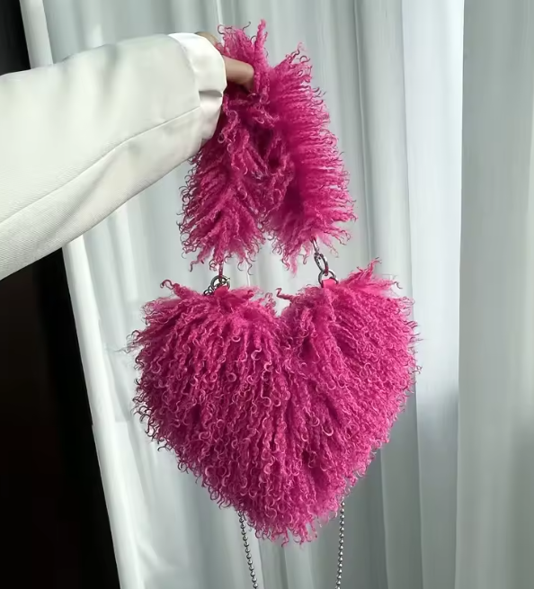 Fuchsia pink heart plush crossbody bag with fuzzy texture and bead chain strap