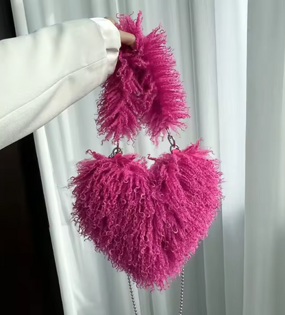 Fuchsia pink heart plush crossbody bag with fuzzy texture and bead chain strap