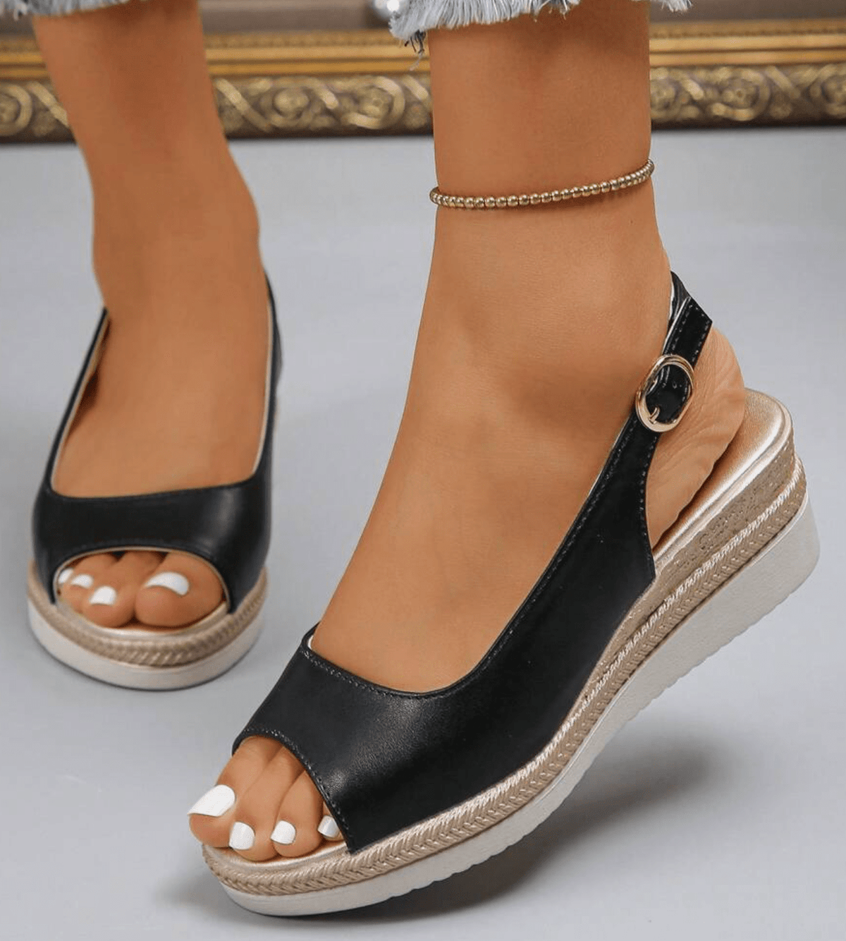 Black orthopaedic wedge sandal with ankle strap and open toe