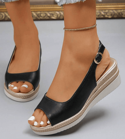 Black orthopaedic wedge sandal with ankle strap and open toe