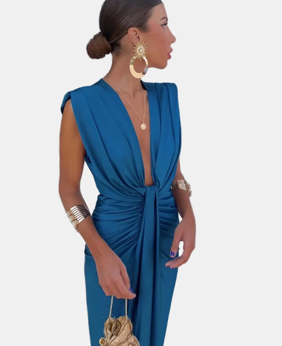Pleated wrap dress in blue with deep V neckline and draped front