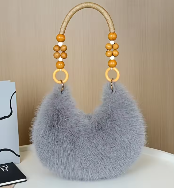 Maine faux hobo handbag with light blue-gray faux-fur body and gold-beaded handles