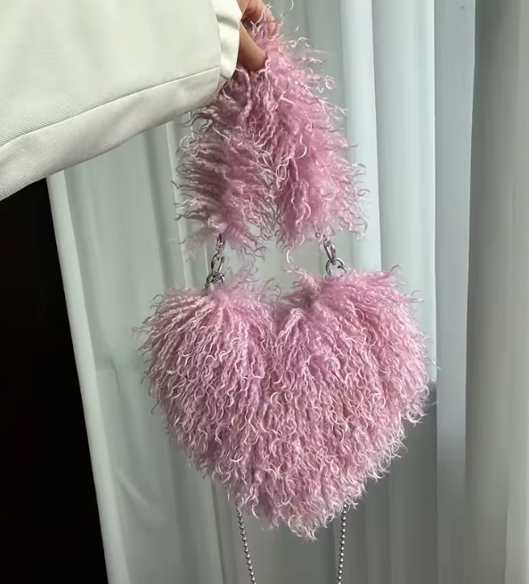 Blush pink heart plush crossbody bag with fuzzy texture and bead chain strap