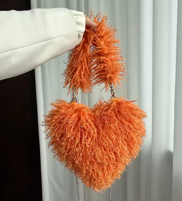 Orange heart plush crossbody bag with fuzzy texture and bead chain strap