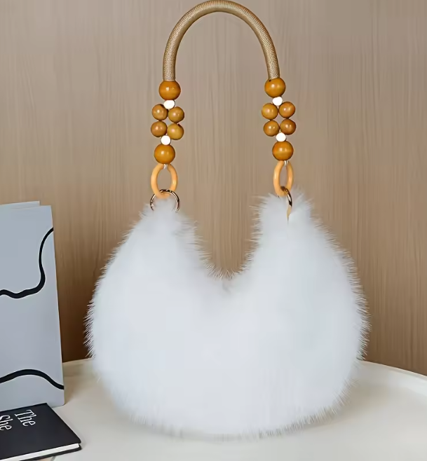 Maine faux hobo handbag with white faux-fur body and gold-beaded handles with rings