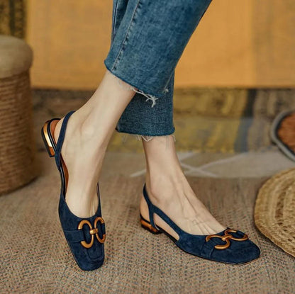 Dark blue orthopedic sandals with gold-tone link ornament and slingback strap