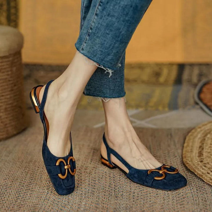 Dark blue orthopedic sandals with gold-tone link ornament and slingback strap