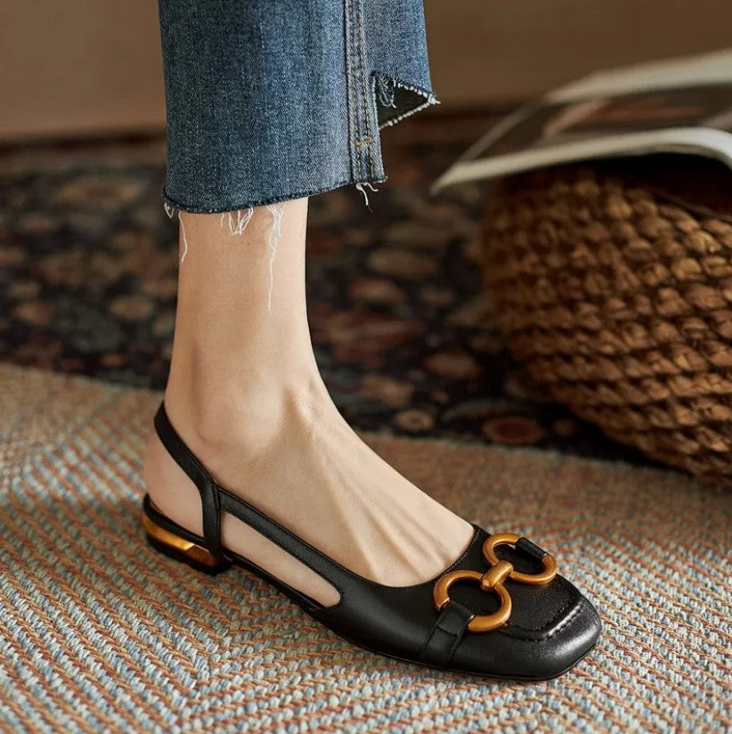 Black orthopedic sandals with gold-tone link detail and low block heel
