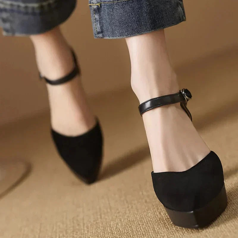 Black pumps with ankle strap buckle and chunky block heel
