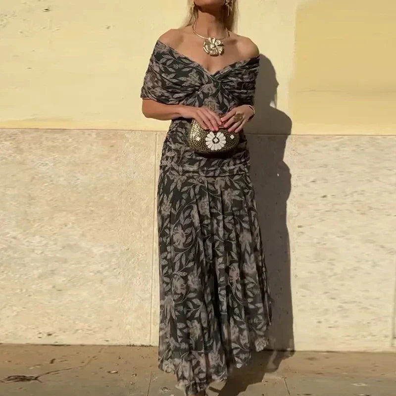 Black and gray floral dress with draped V-neck and gathered waist