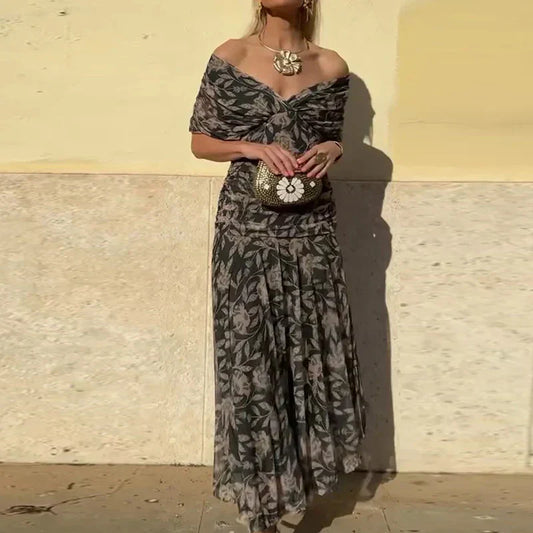 Black and gray floral dress with draped V-neck and gathered waist