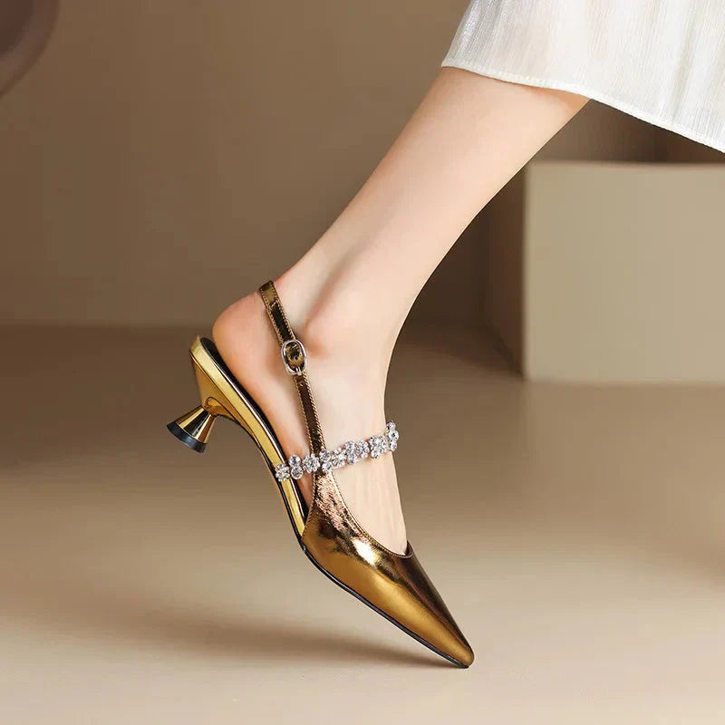 Gold metallic slingback pumps with rhinestone strap and mid block heel